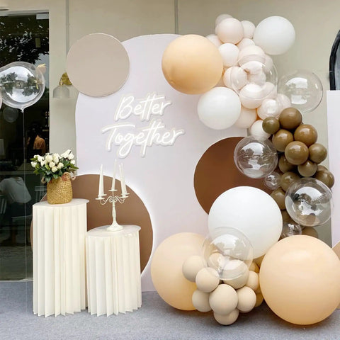 Elegant "Better Together" neon sign on decorated wall with balloons and candles for event decor