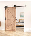 Antique Style Bypass Sliding Wood Barn Door Hardware Kit with Black Top Mounted Tracks and Bearing Rollers for Double Doors installed