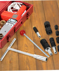 Water Stop Pin Tool With Wrench For Quick Plumbing Leak Fixes And Damage Prevention Durable Pin System in kit on wooden background
