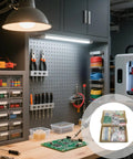 Workshop with tools and Massive 1900 Piece Electronics Component Kit With Transistors PCBs LEDs Resistors And More For DIY Projects.