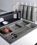 Dang Solid Stainless Steel Bar Glass Rinser With Integrated Drain Tray For Quick Cup Washing In Home Kitchens And Local Pubs Slick Design And Zero Hassle Setup on a countertop.
