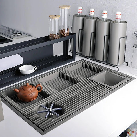 Dang Solid Stainless Steel Bar Glass Rinser With Integrated Drain Tray For Quick Cup Washing In Home Kitchens And Local Pubs Slick Design And Zero Hassle Setup on a countertop.