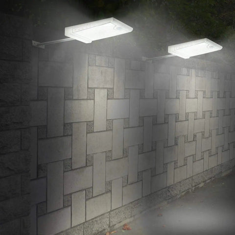 46 LED Solar Outdoor Lights With Mounting Pole 4 Modes Motion Sensor Wall Light illuminating a brick wall at night