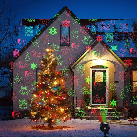 Holiday-decorated house with colorful projector lights and Christmas tree with Star String Lights 43 Ft 100 LED Warm White Fairy Lights With Extendable Waterproof Design 8 Modes For Indoor Outdoor Cozy Decor Perfect For Home Party Wedding Garden Christmas Party Ready.