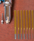 Solid Minhe 7 Piece Punch Set Includes Roll Pin And Chisel Tools Plus Marking Scribe For Watch Repair, Machinery Maintenance, DIY Jobs With Gold Alloy Steel Handle That Is Super Grip Friendly. Seven gold alloy steel punches with roll pin tool on wood surface