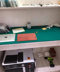 Workbench with electronics soldering workbench mat anti static flexible rubber pad, tools, and accessories for repair and assembly.
