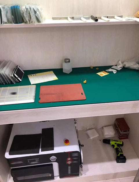 Workbench with electronics soldering workbench mat anti static flexible rubber pad, tools, and accessories for repair and assembly.