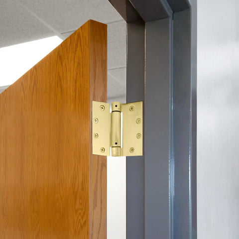 Heavy Duty 4.5 Inch Spring Hinge For Interior And Exterior Doors delivers automatic self closing performance on a wooden door.