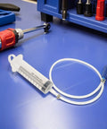 Heavy Duty Manual Fluid Extraction Pump For Automotive Engine Oil Transfer Tool on a blue workbench with tools.