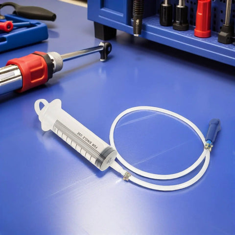 Heavy Duty Manual Fluid Extraction Pump For Automotive Engine Oil Transfer Tool on a blue workbench with tools.