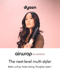 Person holding Coanda 2x Airwrap Multi Styler And Dryer For Straight And Wavy Hair In Ceramic Pink, advertising faster drying.
