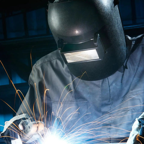 100 Pack Premium Glass Welding Helmet Lenses With Crystal Clear View For Cutting And Grinding in use during welding, sparks flying.