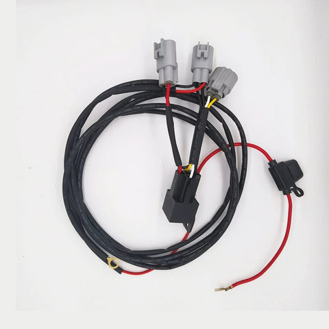 Automotive 12V brake booster vacuum pump wiring harness; black cables with gray connectors and red power lead
