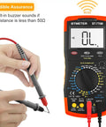 6000-Count True RMS Digital Multimeter With Auto And Manual Ranging, showing display and probes for AC/DC measurement