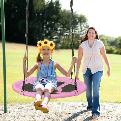 Child swinging on 40 Inch Pink Unicorn Saucer Swing for Kids With Adjustable Ropes and 2 Carabiners Waterproof 900D Oxford Cloth.