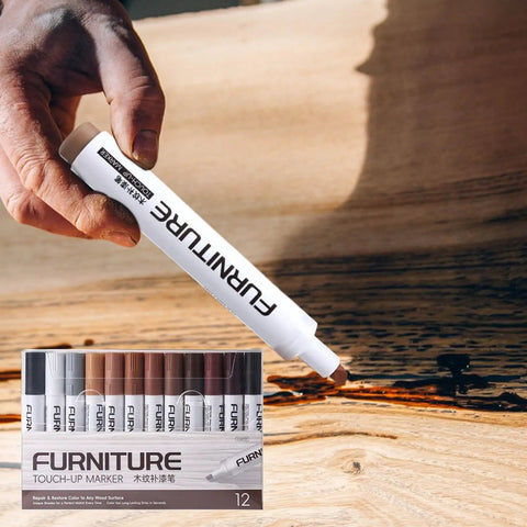 Person using 12 Color Furniture Scratch Repair Markers Kit with Wood Touch Up Stain Pen on wooden surface