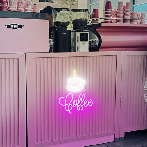 Coffee Cup LED Neon Sign For Home, Cafe, Bar, Or Office, Dimmable 3D Light Up Night Light Wall Decor against pink counter