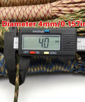 Beefy Heavy Duty Paracord Rope 164 Feet 9 Strand Tactical Utility Cord with caliper measuring 4mm diameter, desert camouflage