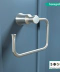 Joleena Towel Ring In Brushed Nickel 8.3 Inches Wide Wall Mount Bath Accessory With Sleek Classic Style Installed on Blue Wall