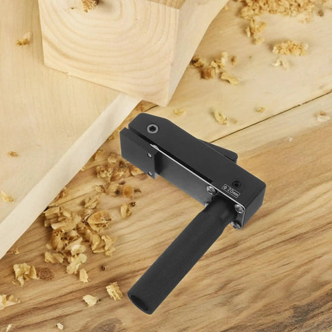 Quick Positioning Aluminum Woodworking Desktop Clamp for Home Workshops next to wood shavings on a workbench