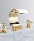 Gold bathroom faucet with crystal handles, curved design against gray background, not related to 5 In 1 LED Shower Panel Tower Faucet.