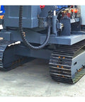 Crawler tracks of Beefy Hydraulic Guardrail Pile Driver Machine for post installation and highway roadside guardrail construction.