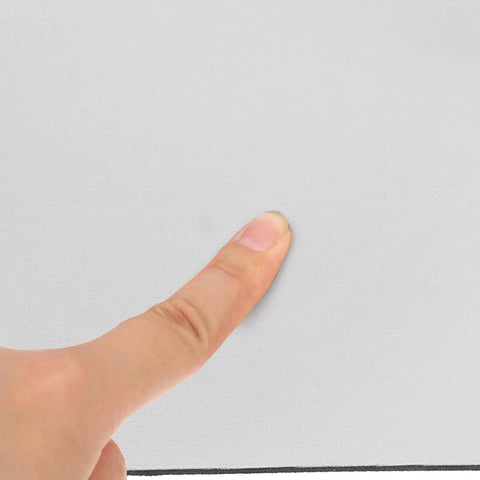 Close-up of a finger touching the texture of the White Sublimation Mouse Pad for Heat Press Transfers, 8.7x7.1 Inch Blank Desk Pad.