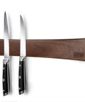 16 Inch Acacia Wood Magnetic Knife Strip Wall Mount with two chef knives displayed, showcasing secure magnetic hold.