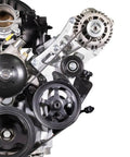 Built Damn Tough Driver Side Alternator And Power Steering Pump Kit For LT Gen 5 Chevy Silverado engine components with pulleys.
