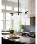 Dope Three Light Modern Industrial Farmhouse Kitchen Island Pendant Lighting With Clear Glass Cylinder Shades in kitchen
