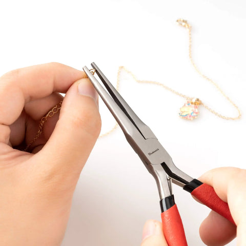 Using 6 Inch Needle Nose Pliers With Extra Long Tapering Non Serrated Jaws For Jewelry Making, gripping gold chain close-up.