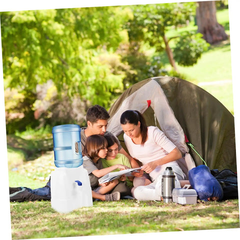 Go-To Mini Desktop Cold Water Dispenser With Built In Tap used outdoors near a tent with a family enjoying a picnic.