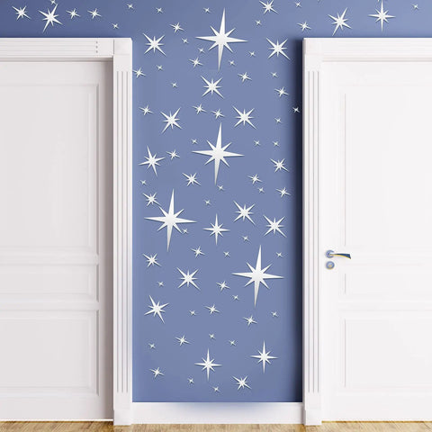 82 Piece 3D Acrylic Mirror Star Wall Stickers Set For Ceiling And Walls on blue wall between white doors