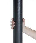 Close-up of hand holding the steel frame pole of a Sturdy 10x12 Patio Gazebo With Outdoor Steel Frame And Mosquito Netting For Lawn, Backyard, Garden Or Deck.