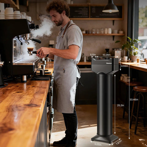 Automatic Electric Portafilter Cleaner Knocks Out Stubborn Coffee Oils In Seconds, shown in cafe with barista and espresso machine.