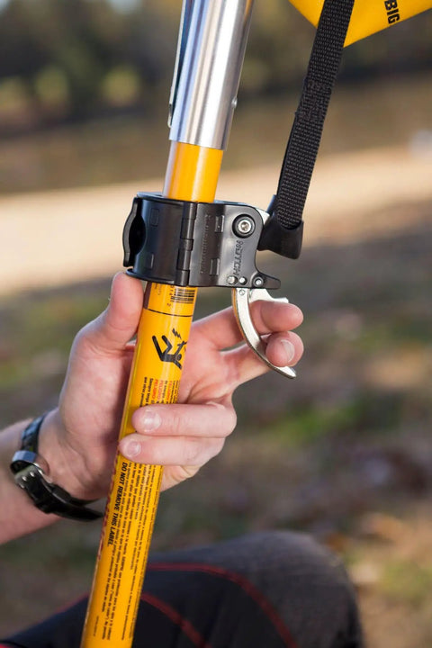 Person holding Big Shot Trigger for smoother launching and snappier line setting with quick mid pole attachment on 1.25 inch fiberglass pole