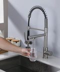 Person using Dope Contemporary Single Handle Kitchen Sink Faucet With Pull Down Sprayer And Pre Rinse Style, Brushed Nickel