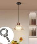 12 Pack M3 Stainless Steel Eye Bolts For Lifting, highlighted next to a hanging pendant light in a modern interior.