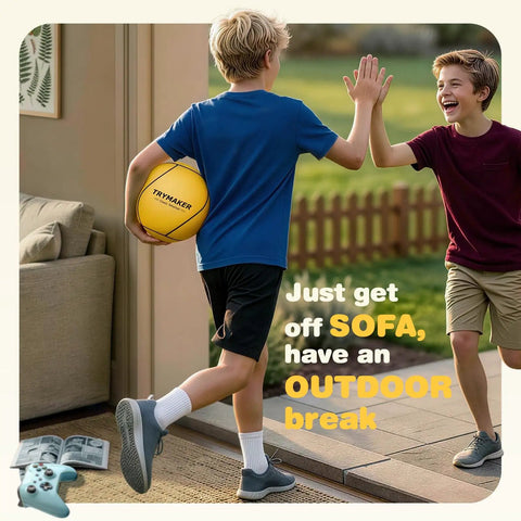 Boy holding tetherball with another boy outdoors; Ultimate Tetherball Set With Ball, Rope And Carabiner For Backyard Fun labeled on ball.
