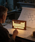 Solid Wood Periodic Table Desk Lamp With Warm Led Glow Usb Powered Science Study Gear A Hella Bright Setup For Chemistry Classrooms Dorms And Teacher Gifts Right Now, dimly lit study scene.
