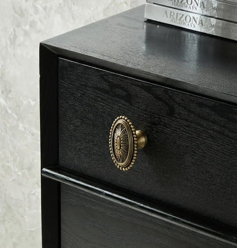 Antique Brass Floral Carved Cabinet Knobs Set For Dresser And Cabinets on black drawer, detailed close-up, vintage style
