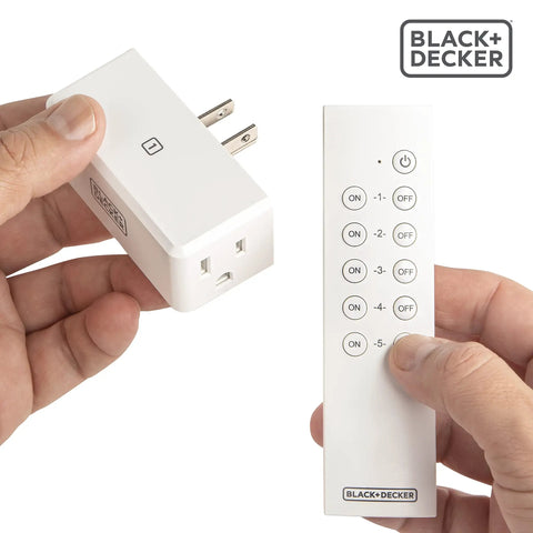 Person holding a plug and remote from a Wireless Remote Outlet Pack With Five Outlets And Two Remotes For Easy Home Control Plug And Play Smart Switches For Lamps Fans And Small Appliances Simple Convenient Hands Free Power