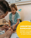 Front view: Be Smart Get Prepared 110-pc First Aid Kit used as man applies bandage to child's knee on kitchen counter.