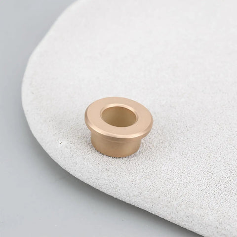 8 Pack Flanged Copper Sleeve Bushings 8 Mm Bore 12 Mm OD 8 Mm Long displayed on a textured surface, showcasing flanged design.