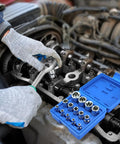 Mechanic using the 14-Piece Female E-Torx Socket Set With E4 Through E24 External Star Sockets For One Quarter Inch, Three Eighth Inch, And One Half Inch Drives, Pro Grade Cr-V Steel, Compatible With Regular And E-Torx Plus, Auto Repair Kit With Storage Case on an engine.