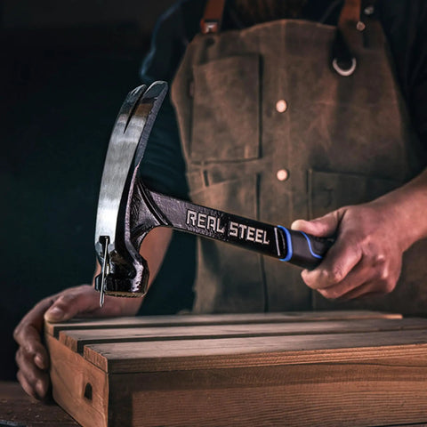 21 Oz One Piece Forged Milled Face Framing Hammer With Rip Claw 0517 Black Beefy High Carbon Steel in carpenter's hand