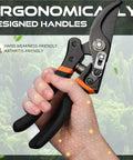 Hand holding 8.5 Inch Pruning Shears For Easy Cuts With Ultra Sharp Japanese Steel Titanium Blade Arthritis Friendly Garden Clippers.