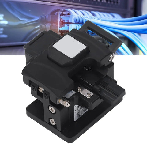 This Sleek Optical Fiber Cleaver Delivers Insanely Precise Cuts With A Tight 0.5 Degree Angle Perfect For Reliable Cold Splicing And Hot Melting Jobs On Site Featuring An Auto Blade Return Mechanism Plus Smart Portability Design To Get Your Fiber Cable, showing black handheld cleaver for optic fiber cutting.