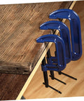Beefy Heavy Duty 6-Inch G Clamps for Woodworking and Metalworking, quick-release table mount C-Clamps in use on wooden desk.