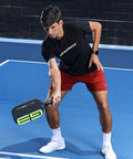 Man playing pickleball with G3 Powerband Pickleball Paddle With 16mm Core, Carbon Fiber Face, Textured Spin Surface, Lightweight 8 Oz